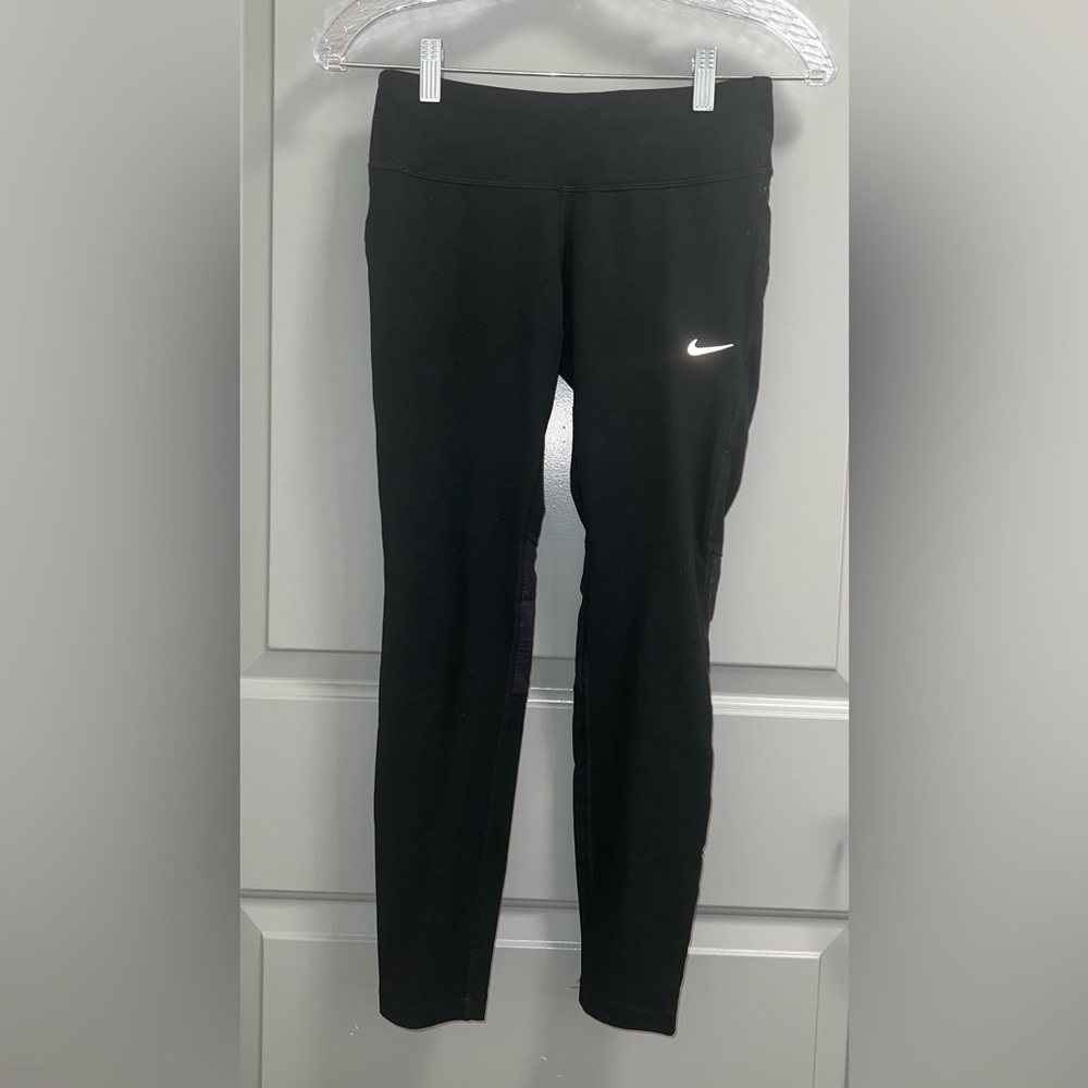Nike black leggings with mesh inserts, size M